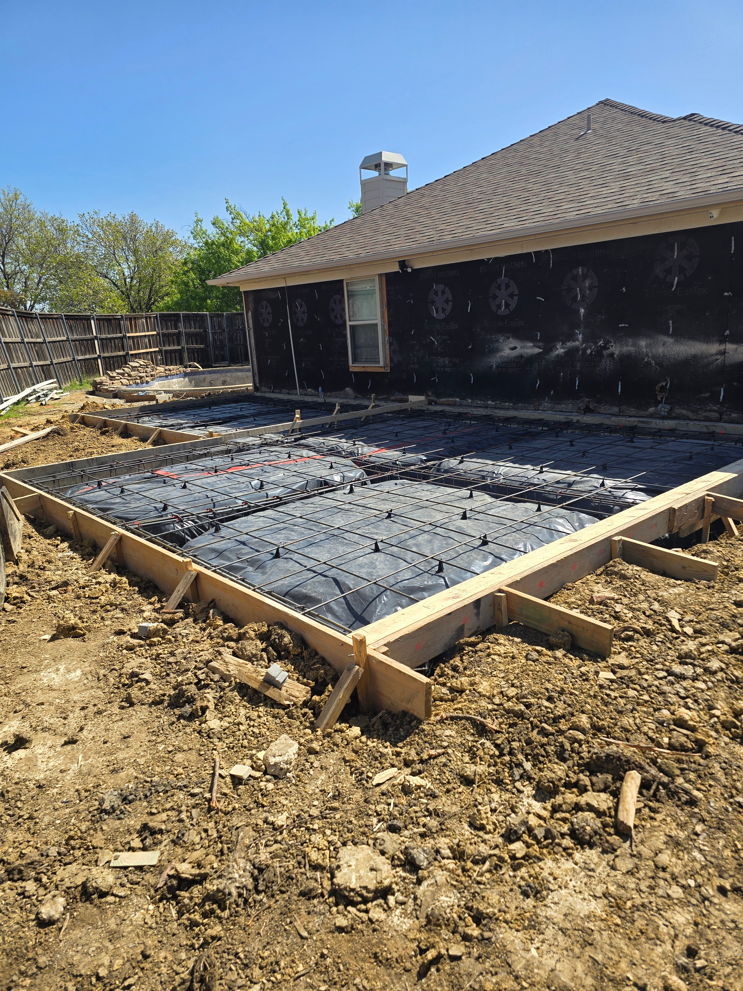 Crew setting foundation formwork and rebar in DFW